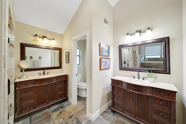 10 Featherfall Pl, Spring, TX 77381 - full bathroom with two vanities and lofted ceiling