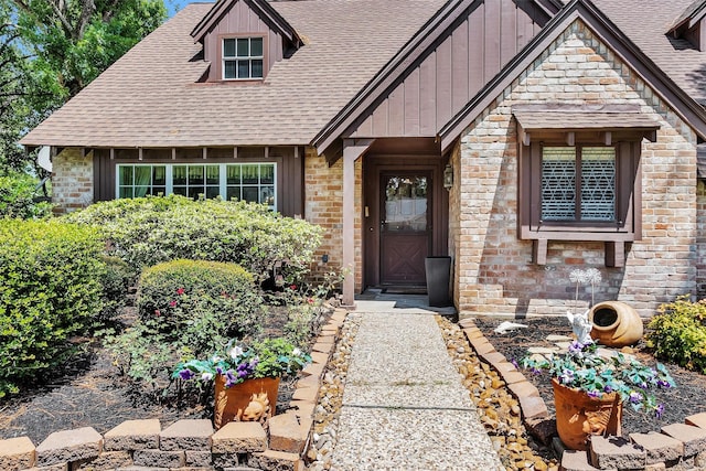 5934 Foresthaven Dr, Houston, TX 77066 - property entrance with roof with shingles and board and batten siding