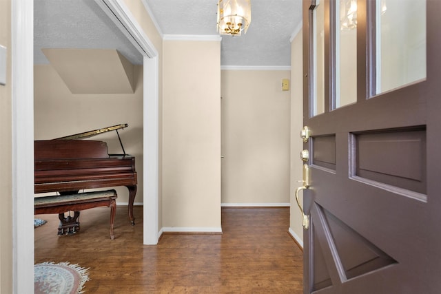 5934 Foresthaven Dr, Houston, TX 77066 - entryway featuring crown molding, wood finished floors, a chandelier, and a textured ceiling