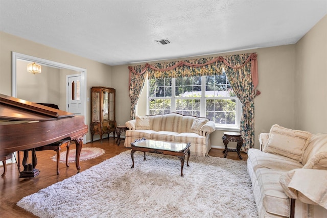 5934 Foresthaven Dr, Houston, TX 77066 - living room featuring wood finished floors and a textured ceiling