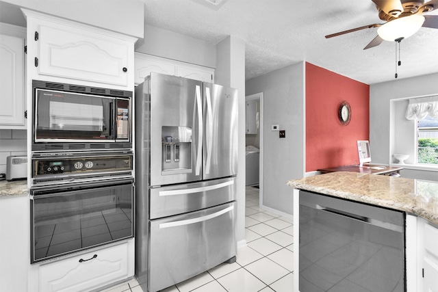 5934 Foresthaven Dr, Houston, TX 77066 - kitchen featuring black appliances, white cabinets, a ceiling fan, light tile patterned flooring, and light stone counters