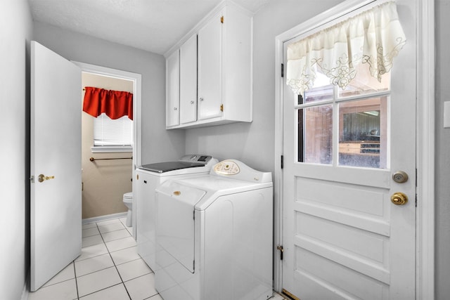 5934 Foresthaven Dr, Houston, TX 77066 - laundry area with washing machine and clothes dryer and light tile patterned floors
