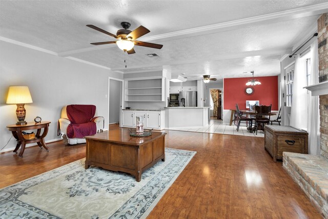 5934 Foresthaven Dr, Houston, TX 77066 - living area featuring a ceiling fan, wood finished floors, a textured ceiling, and crown molding
