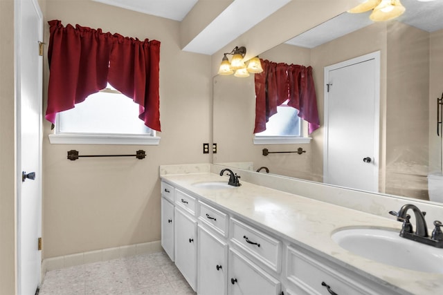 5934 Foresthaven Dr, Houston, TX 77066 - full bathroom with double vanity and baseboards