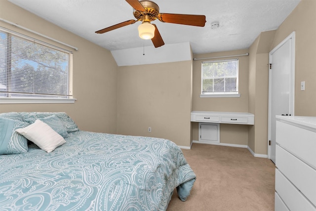 5934 Foresthaven Dr, Houston, TX 77066 - bedroom with light carpet, vaulted ceiling, and ceiling fan