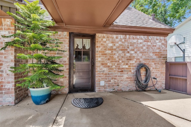 5934 Foresthaven Dr, Houston, TX 77066 - property entrance featuring brick siding and a shingled roof