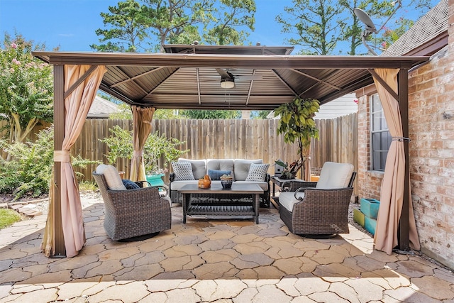 5934 Foresthaven Dr, Houston, TX 77066 - fenced backyard featuring a gazebo, outdoor lounge area, a patio area, and ceiling fan