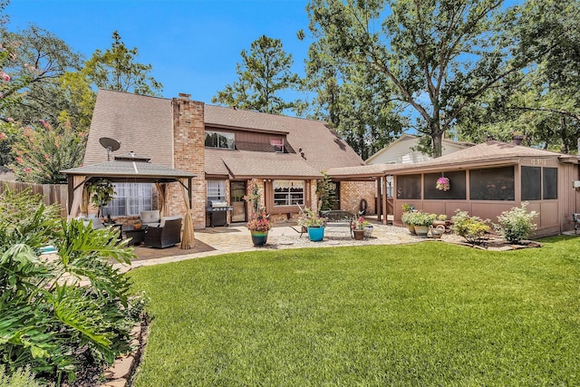 5934 Foresthaven Dr, Houston, TX 77066 - rear view of property with roof with shingles, a gazebo, a patio area, a sunroom, and a chimney