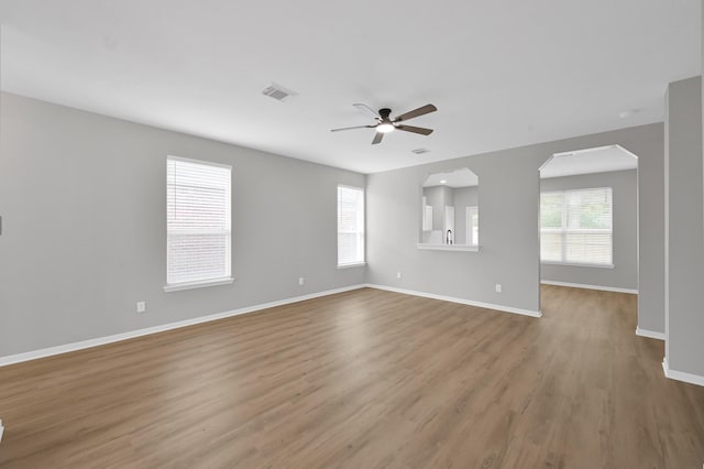 23911 Pinecreek Pt, Spring, TX 77373 - empty room featuring a ceiling fan and wood finished floors