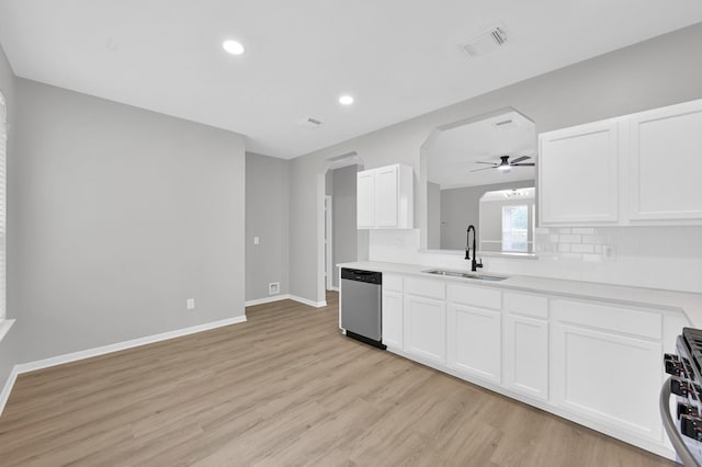 23911 Pinecreek Pt, Spring, TX 77373 - kitchen featuring arched walkways, light wood-type flooring, ceiling fan, white cabinetry, and recessed lighting