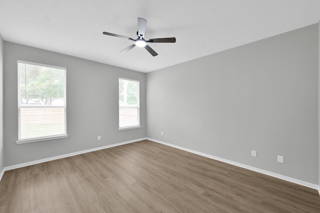 23911 Pinecreek Pt, Spring, TX 77373 - empty room with wood finished floors and ceiling fan