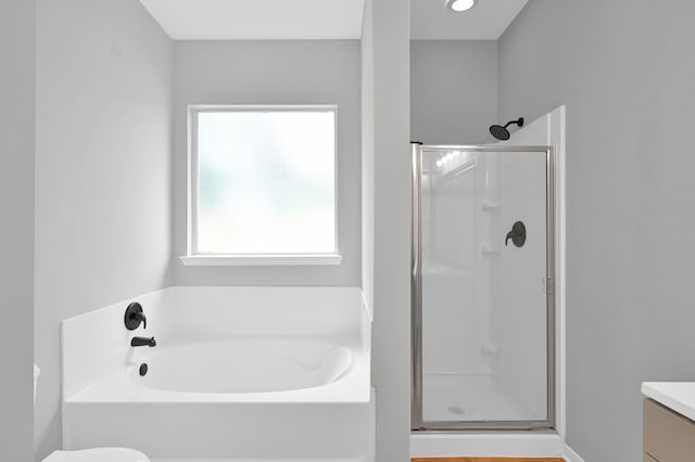 23911 Pinecreek Pt, Spring, TX 77373 - bathroom featuring a shower stall, vanity, and a garden tub