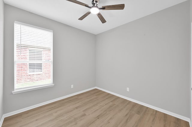 23911 Pinecreek Pt, Spring, TX 77373 - spare room with light wood-style floors and a ceiling fan