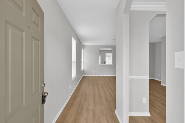 23911 Pinecreek Pt, Spring, TX 77373 - corridor featuring light wood-style flooring and arched walkways