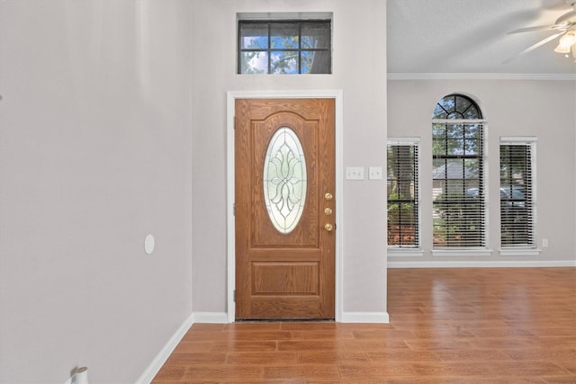4303 Appalachian Trl, Houston, TX 77345 - foyer entrance featuring ceiling fan, light wood finished floors, and crown molding
