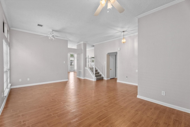 4303 Appalachian Trl, Houston, TX 77345 - unfurnished room featuring a ceiling fan, a textured ceiling, light wood-type flooring, stairway, and crown molding