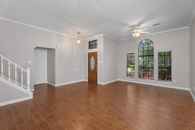 4303 Appalachian Trl, Houston, TX 77345 - unfurnished living room with ceiling fan, stairway, wood finished floors, ornamental molding, and a textured ceiling