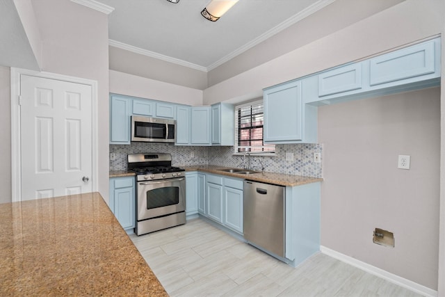 4303 Appalachian Trl, Houston, TX 77345 - kitchen with stainless steel appliances, blue cabinetry, tasteful backsplash, crown molding, and light stone counters