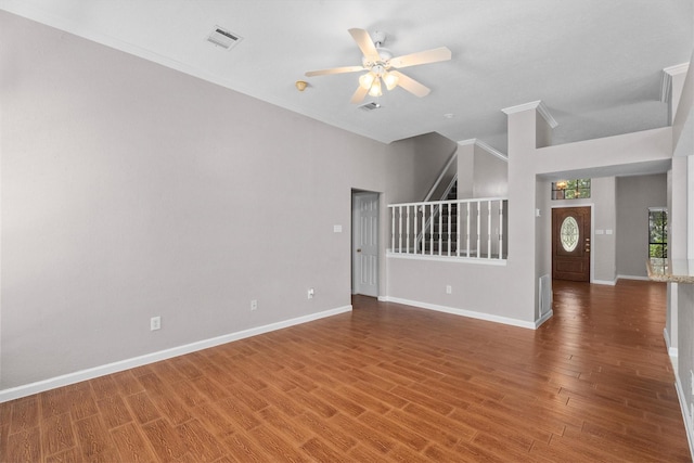 4303 Appalachian Trl, Houston, TX 77345 - empty room with stairs, ceiling fan, wood finished floors, and ornamental molding