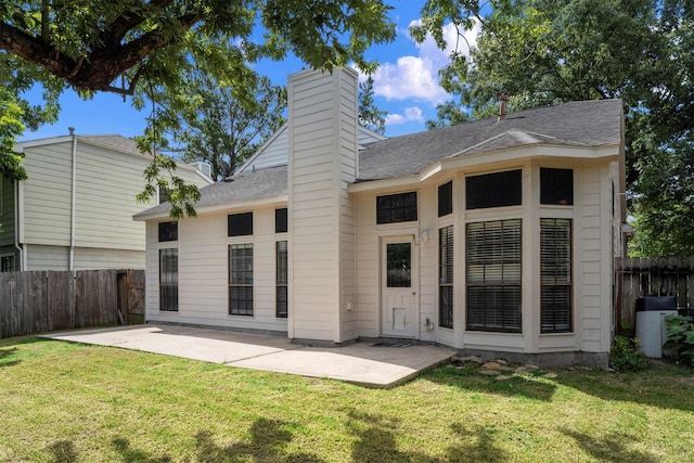 4303 Appalachian Trl, Houston, TX 77345 - back of property featuring roof with shingles, a patio area, and a chimney