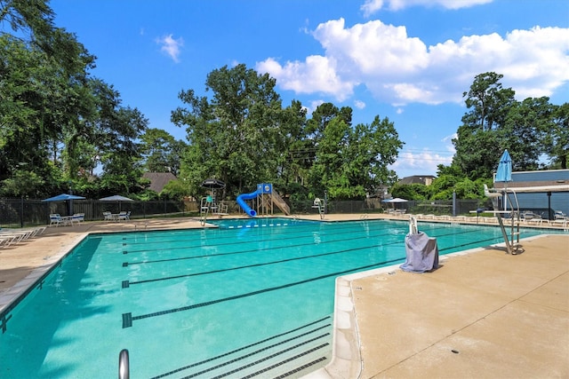 4303 Appalachian Trl, Houston, TX 77345 - community pool with a water slide and a patio area