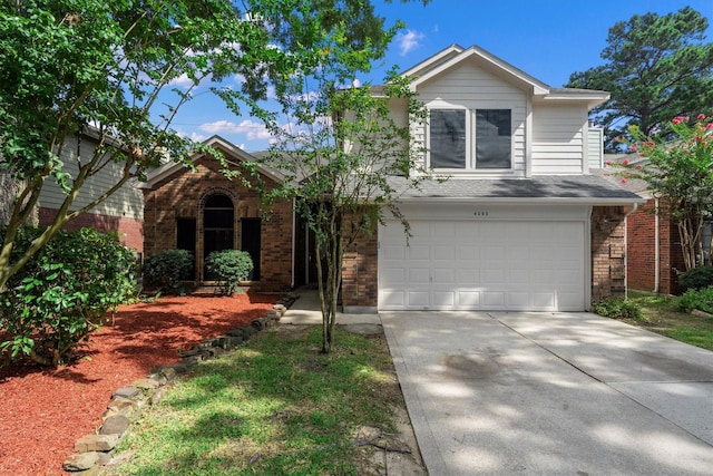 4303 Appalachian Trl, Houston, TX 77345 - traditional-style house with a garage, driveway, brick siding, and roof with shingles