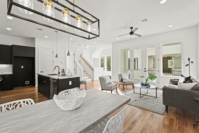 9426 Campbell Rd Unit B, Houston, TX 77080 - dining space with a ceiling fan, wood finished floors, recessed lighting, and stairs