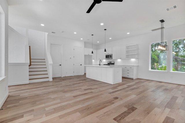 9426 Campbell Rd Unit B, Houston, TX 77080 - kitchen with open shelves, a ceiling fan, white cabinetry, recessed lighting, and light wood finished floors