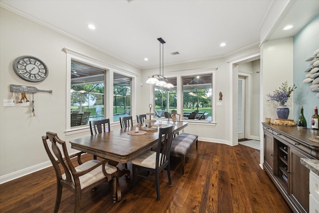 3848 S Main St, Anahuac, TX 77514 - dining space featuring dark wood-style flooring, healthy amount of natural light, crown molding, and recessed lighting