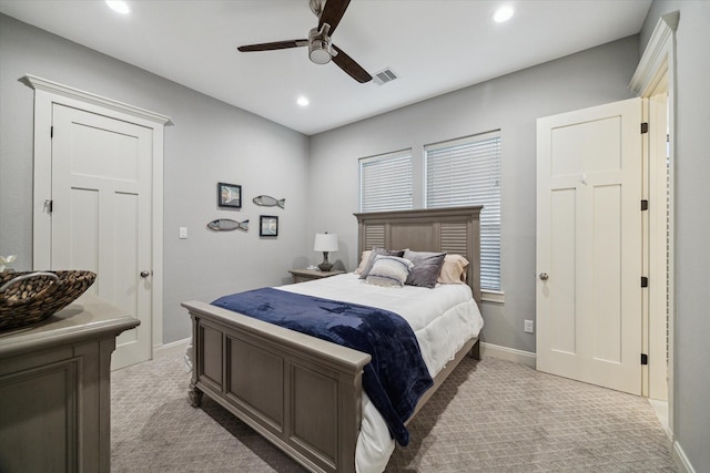 3848 S Main St, Anahuac, TX 77514 - bedroom with light colored carpet, recessed lighting, and a ceiling fan