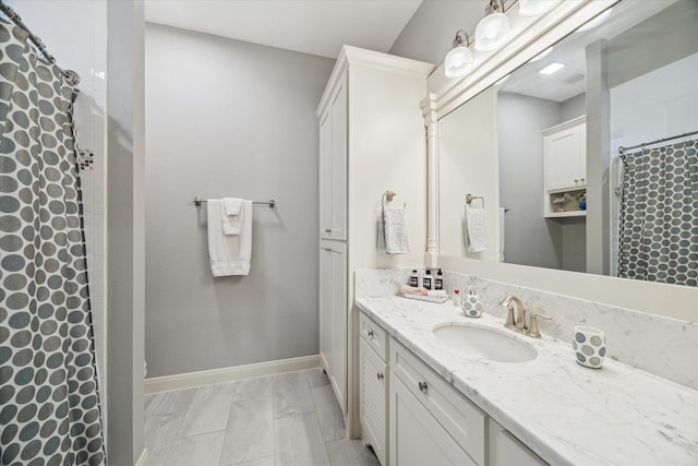 3848 S Main St, Anahuac, TX 77514 - full bathroom featuring vanity, marble finish flooring, and curtained shower
