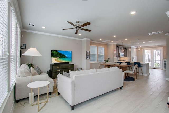 1912 Honey Mound Dr, Houston, TX 77080 - living room featuring plenty of natural light, recessed lighting, ceiling fan, and crown molding