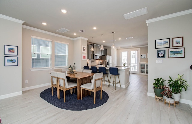 1912 Honey Mound Dr, Houston, TX 77080 - dining space featuring ornamental molding, light wood-style floors, recessed lighting, and french doors