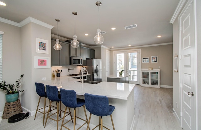 1912 Honey Mound Dr, Houston, TX 77080 - kitchen featuring a peninsula, recessed lighting, light wood finished floors, light countertops, and tasteful backsplash