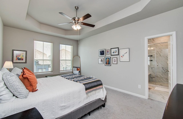 1912 Honey Mound Dr, Houston, TX 77080 - bedroom featuring a tray ceiling, connected bathroom, and ceiling fan