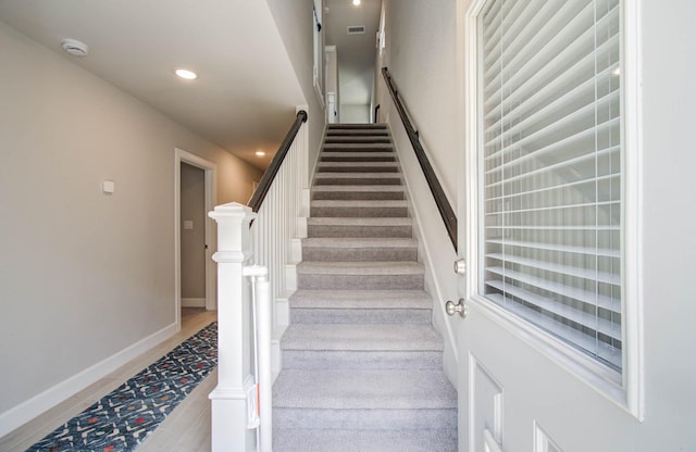 1912 Honey Mound Dr, Houston, TX 77080 - stairs with recessed lighting and baseboards