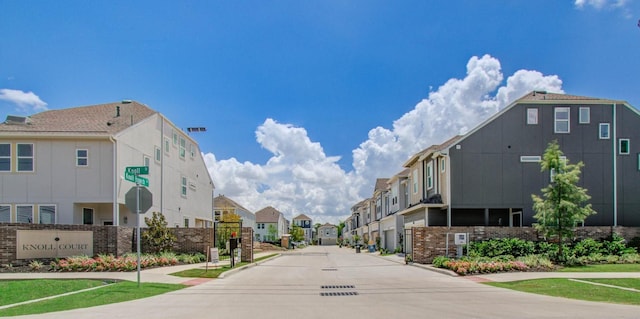 1912 Honey Mound Dr, Houston, TX 77080 - view of concrete street with a residential view, traffic signs, curbs, and sidewalks