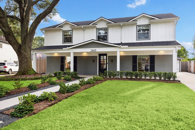 5623 Oak Trail Ln, Houston, TX 77091 - view of front facade featuring a porch, concrete driveway, and roof with shingles