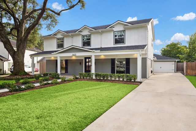 5623 Oak Trail Ln, Houston, TX 77091 - view of front facade with covered porch, concrete driveway, and a shingled roof
