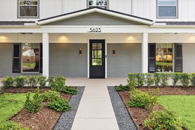 5623 Oak Trail Ln, Houston, TX 77091 - entrance to property with board and batten siding, a porch, and brick siding