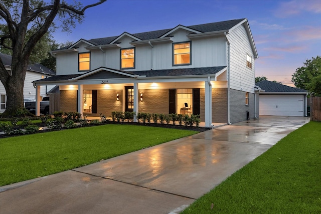 5623 Oak Trail Ln, Houston, TX 77091 - view of front of property featuring covered porch, brick siding, a yard, a detached garage, and a shingled roof