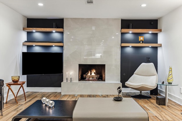 5623 Oak Trail Ln, Houston, TX 77091 - living room featuring wood finished floors, a premium fireplace, and recessed lighting
