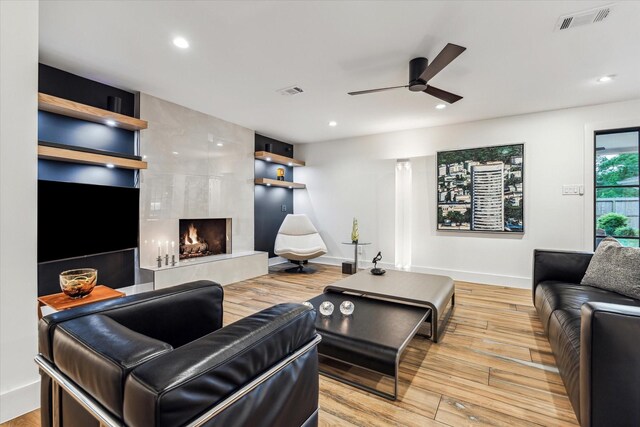 5623 Oak Trail Ln, Houston, TX 77091 - living area featuring a ceiling fan, a premium fireplace, wood finished floors, and recessed lighting