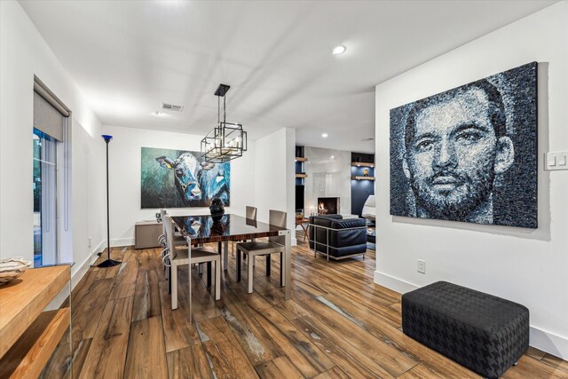 5623 Oak Trail Ln, Houston, TX 77091 - dining room featuring wood finished floors, a chandelier, and recessed lighting