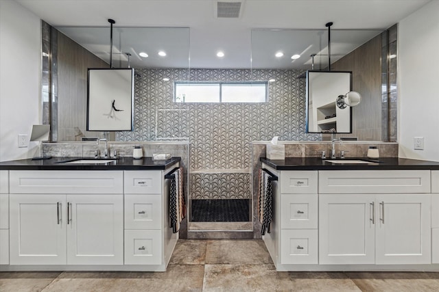 5623 Oak Trail Ln, Houston, TX 77091 - full bathroom featuring a walk in shower and two vanities