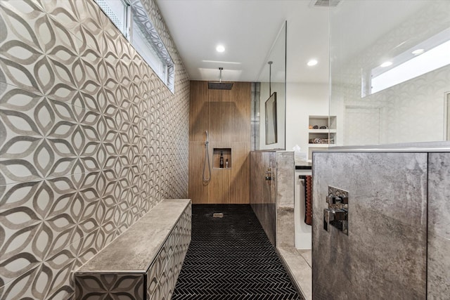 5623 Oak Trail Ln, Houston, TX 77091 - bathroom featuring a walk in shower, tile walls, and recessed lighting