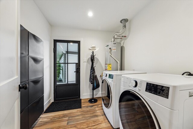 5623 Oak Trail Ln, Houston, TX 77091 - laundry room with gas water heater, washing machine and clothes dryer, light wood finished floors, and recessed lighting
