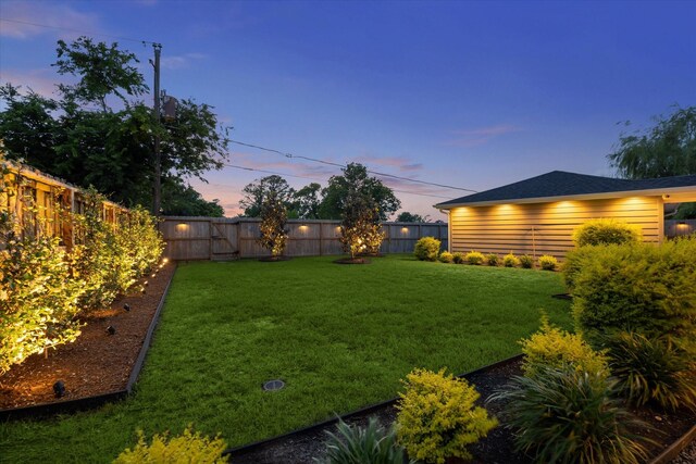 5623 Oak Trail Ln, Houston, TX 77091 - yard at dusk with a fenced backyard