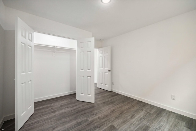 2310 Wavell St, Houston, TX 77088 - unfurnished bedroom with dark wood-type flooring and a closet
