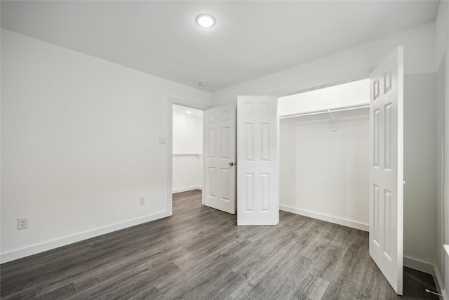 2310 Wavell St, Houston, TX 77088 - unfurnished bedroom featuring dark wood-style flooring and a closet